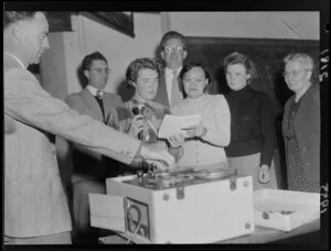 Miss LA Borsboom, from Holland, with Miss S [Ondravudti?], from Thailand, recording a message onto a tape recorder