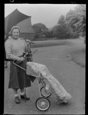 Participants in Ladies Golf Tournament at Heretaunga, New Zealand v Great Britain, with umbrellas