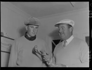 New Zealand golfer Bob Charles stands alongside South African golfer Bobby Locke, who is holding a golf club, Miramar Golf Course, Wellington
