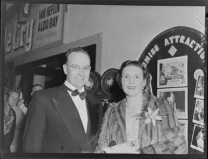 Unidentified man and woman at the premiere of the film The Dam Busters, at the Majestic Theatre, Willis Street, Wellington