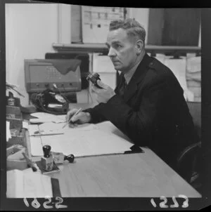 'Police night patrol' with officer attending to paperwork