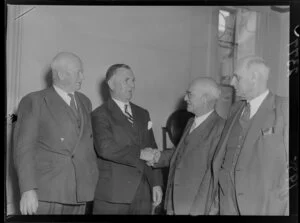 Prime Minister Sid Holland being congratulated after twenty years of political service
