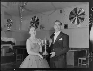 Miss J B Connor and Mr F Anderson, national professional ballroom dancing champions, with trophy