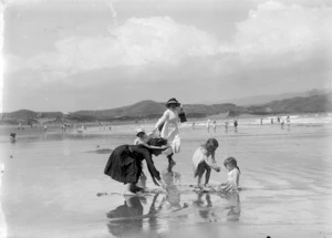Women and children at the beach