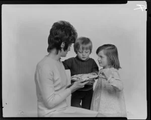 Woman and two children with crackers on a plate