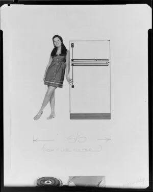 Girl standing by fridge