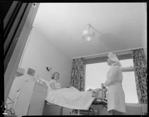 Patient and nurse in hospital room