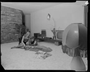 Young people with dog in lounge