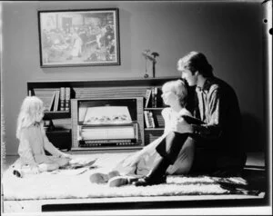 Family in front of Magicoal heater