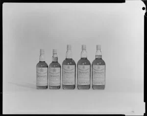 Bottles of Dewar's whiskey in a row