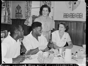 Fijian shot-putter Mataiki Tuicaka with Mrs A C Reay and Mrs R W Peacock, 1950 British Empire Games village, Ardmore