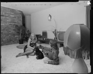 Young people with dog in lounge