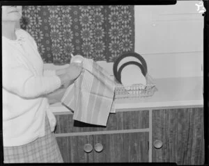 Woman with tea towels