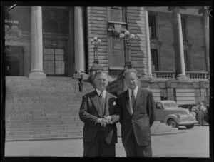 The Prime Minister, Sidney Holland (left), with Dag Hammarskjold, United Nations Secretary-General, standing in front of Parliament Buildings, Wellington
