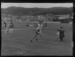 Athletics meeting at Basin Reserve, Wellington, featuring the finish line of a women's running race