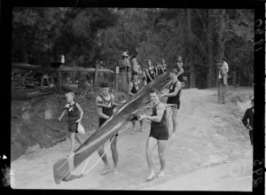 New Zealand men's eights rowing team carrying boat to water, 1950 British Empire Games, Lake Karapiro
