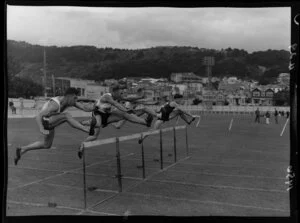 Athletics meeting at Basin Reserve, Wellington, featuring men's hurdles race
