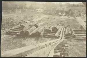 Logs and log hauler at a sawmill