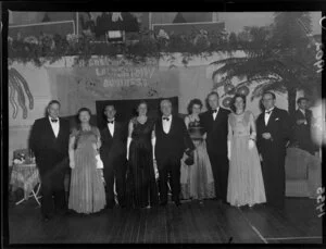 Walter Nash, leader of the Labour Party, with his wife and an unidentified group of people at the A & P Association ball in Lower Hutt