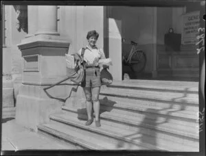 Mrs Jean Scarlett, Postie with bags of mail outside Post Office Building, Customhouse Quay, Wellington