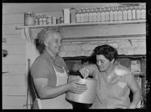 Two women preparing food for sheep shearers at Ohinewairua Station