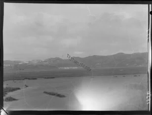 Banner with words 'Enter ladies flying test' being flown around Wellington by the Wellington Aero Club