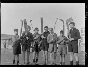 'Boys of Clyde Quay School have got the hockey bug' (caption), showing boys with improvised hockey sticks, Clyde Quay School, Wellington