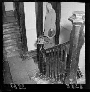 Unidentified elderly man in the stairwell of the boarding house in Molesworth Street, formerly the home of the Prime Minister, Richard Seddon