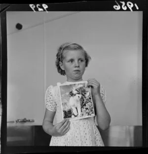 Faye Anderson with a photograph of her dog, Tiger