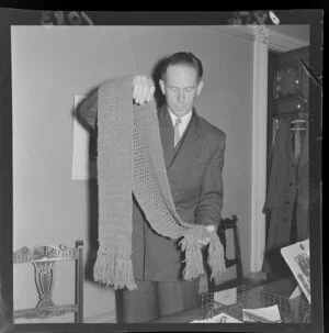 Mr J Wilson with The Queen's Scarf of Honour, crocheted by Queen Victoria, [at the General Assembly Library?]