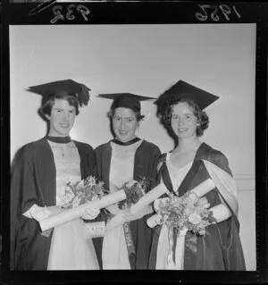 Three unidentified women graduating, Victoria University capping ceremony, Wellington Town Hall