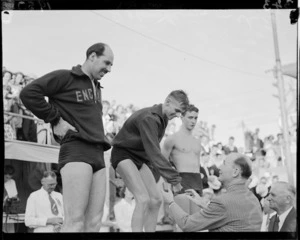 D Hawkins on victory stand, 1950 British Empire Games, Auckland