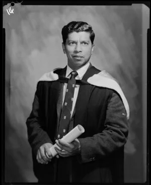 Fernandez, man in academic gown with diploma