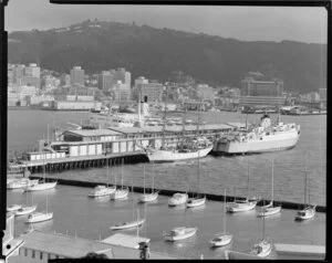 Sailing ship ARC Gloria and inter island ferry berthed at overseas terminal, Wellington harbour