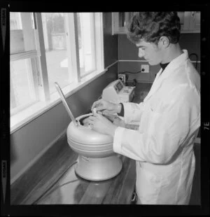 Man using a centrifugal machine at the Central Institute of Technology, Petone