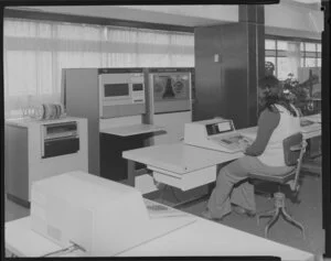 Woman operating large computer