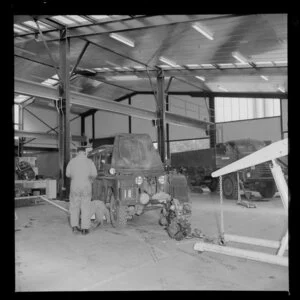 Men fixing a jeep, Royal Electrical and Mechanical Engineers workshop, Waiouru military camp