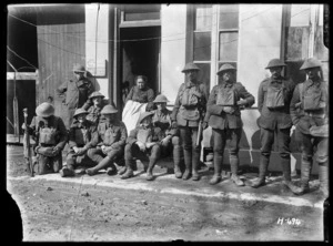 New Zealand troops with an old lady who is the only civilian left in the village and stubbornly refuses to leave despite the shells, Mailly