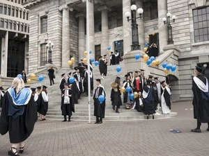 Massey University graduates outside Parliament