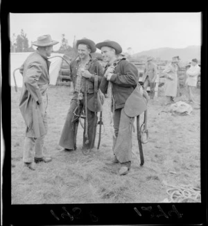 Riders carrying saddles at the Raetihi rodeo