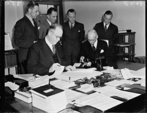 Hon William Sullivan signing immigration agreement at Parliament