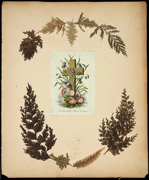 Page of scrapbbok decorated with New Zealand ferns and a greeting card