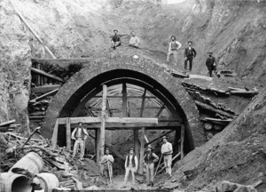 Unidentified workers near the shell of the Karori Tunnel under construction