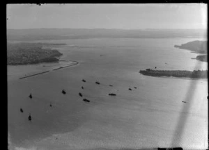 View to Westhaven Marina and Saint Mary's Bay to Northcote Peninsula with a flotilla of ships on Auckland Harbour