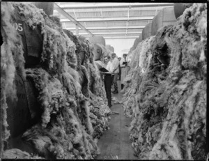 Buyers examining wool