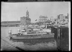 View of Auckland Ferry Building and launches at Freemans Bay