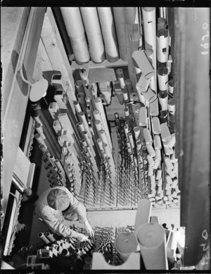 Harry A Tustin working on the reconditioning of the organ in the Wellington Town Hall