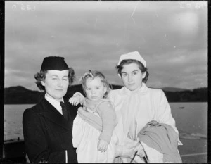 Stewardess with passengers from the first TEAL Solent flying boat flight from Sydney to Wellington