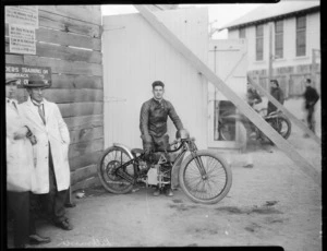 Wally Kilmister, speedway rider, on Douglas motorcycle, at Kilbirnie stadium, Wellington