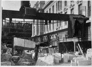 [Marble for Parliament Buildings being unloaded in Parliament street by a gantry crane]